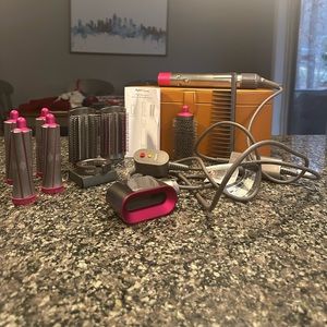 Dyson Airwrap complete offers considered hair dryer curling iron drying brush